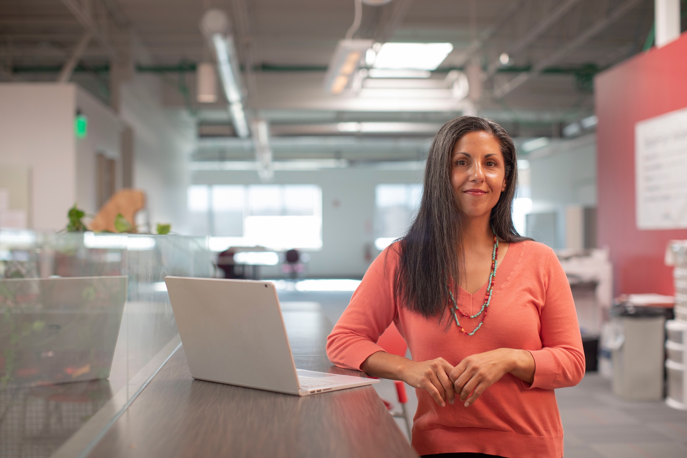 A professional presenting to colleagues in a bright office